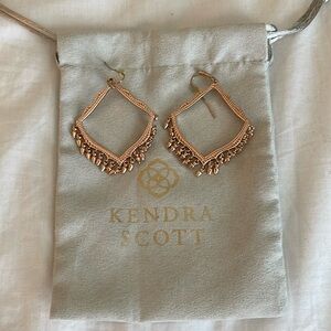 Kendra Scott rose gold chandelier earrings.